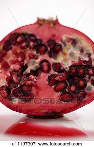 Stock Photo - Close-up cross section of pomegranate. Fotosearch