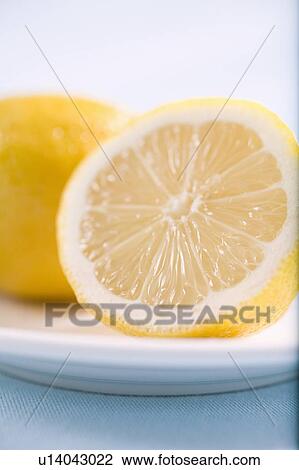 Stock Image - Close-up of half lemon. Fotosearch