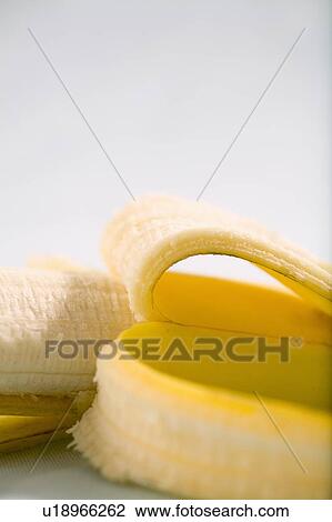 Partly peeled banana View Large Photo Image Stock Image - Partly peeled banana. Fotosearch