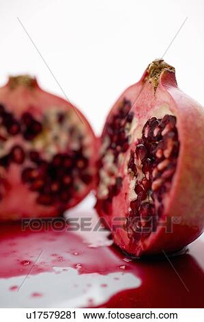 Stock Image - Pomegranate cut in 2. Fotosearch