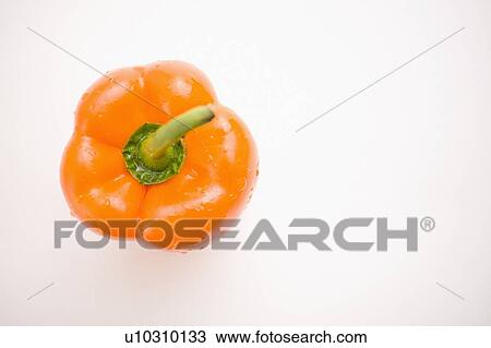Stock Image - Single orange pepper, from above. Fotosearch