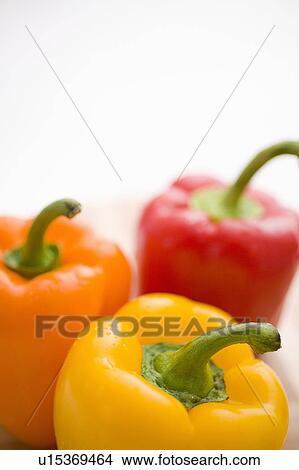 Yellow, orange and red peppers View Large Photo Image Picture - Yellow, orange and red peppers. Fotosearch