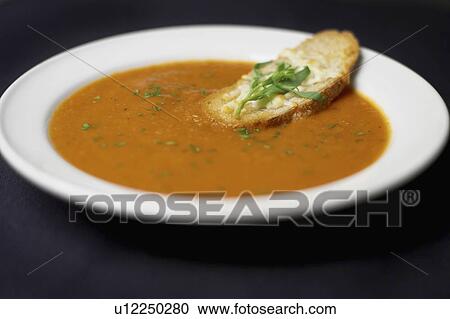 Bowl of Moroccan Spiced Tomato and Fennel Soup with crusty cheese bread View Large Photo Image Stock Image - Bowl of Moroccan Spiced Tomato and Fennel Soup with crusty cheese bread. Fotosearch