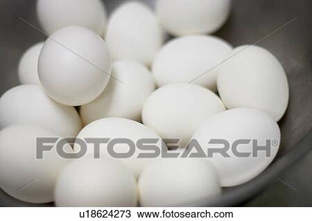 Stock Image - Bowl of white chicken eggs. Fotosearch