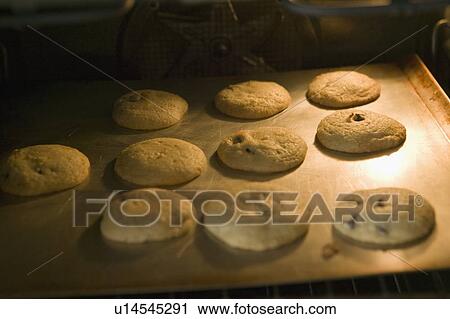 Chocolate Chip Cookies Baking in an Oven View Large Photo Image Stock Image - Chocolate Chip Cookies Baking in an Oven. Fotosearch