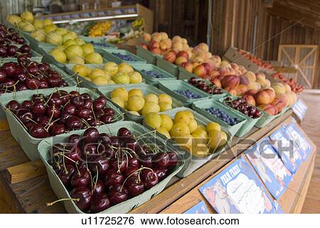 Stock Photograph - Fresh fruit at a roadside fruit stand, Keremeos, BC, Canada. Fotosearch