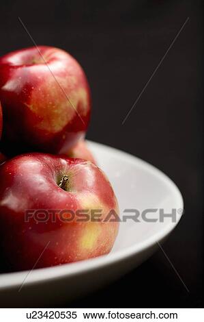 Stock Photography - Organic apples in bowl. Fotosearch