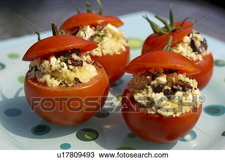 Stuffed tomato appetizer on polka-dotted turquoise plate, Canada, Ontario View Large Photo Image Stock Image - Stuffed tomato appetizer on polka-dotted turquoise plate, Canada, Ontario. Fotosearch