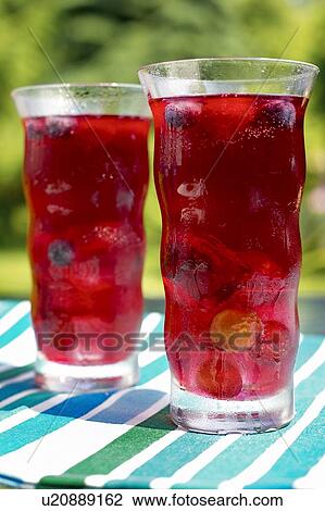 Two glasses of fruit juice, Canada, Ontario View Large Photo Image Stock Image - Two glasses of fruit juice, Canada, Ontario. Fotosearch