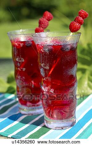 Two glasses of fruit juice garnished with raspberries, Canada, Ontario View Large Photo Image Stock Image - Two glasses of fruit juice garnished with raspberries, Canada, Ontario. Fotosearch