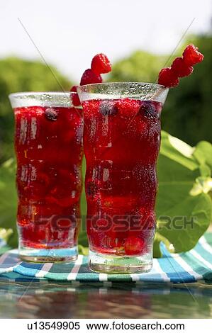 Two glasses of fruit juice garnished with raspberries, Canada, Ontario View Large Photo Image Stock Photography - Two glasses of fruit juice garnished with raspberries, Canada, Ontario. Fotosearch