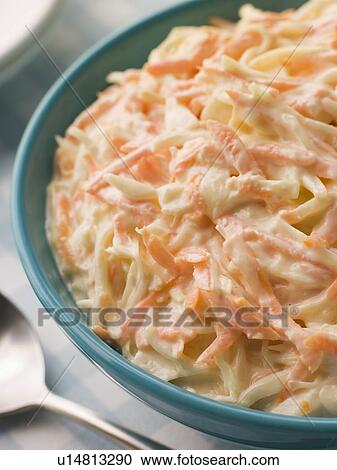 Stock Image - Bowl of Coleslaw with a Spoon. Fotosearch