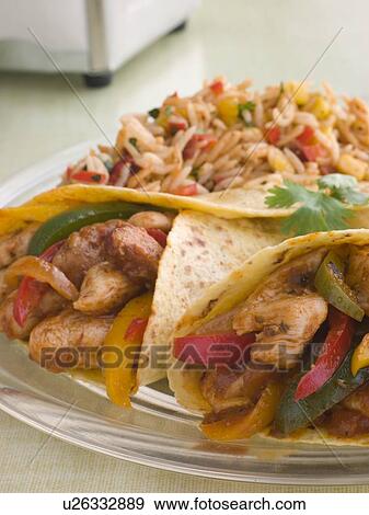 Stock Photo - Chicken Fajita Wraps with Jambalaya. Fotosearch