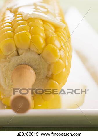 Stock Image - Corn on the Cob with Melted Butter. Fotosearch