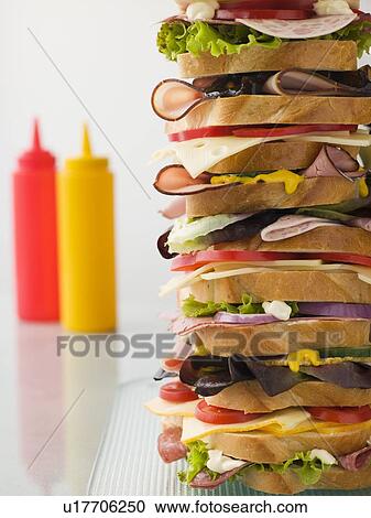 Dagwood Tower Sandwich With Sauces View Large Photo Image Stock Image - Dagwood Tower Sandwich With Sauces. Fotosearch