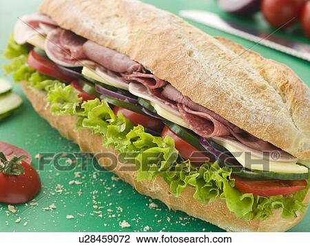 Deli Sub Sandwich on a Chopping Board View Large Photo Image Stock Image - Deli Sub Sandwich on a Chopping Board. Fotosearch