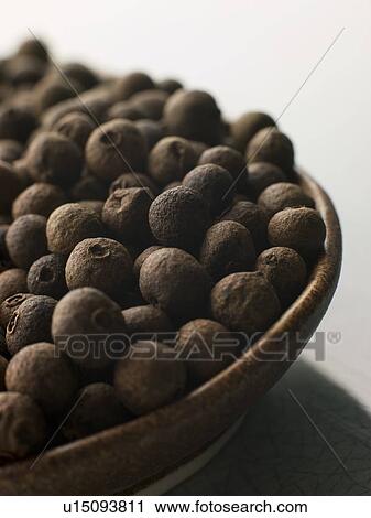 Stock Image - Dish of Allspice Corns. Fotosearch