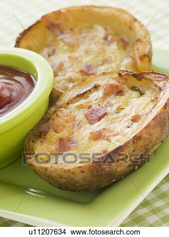 Ham and Cheddar Cheese Stuffed Potato Skins View Large Photo Image Picture - Ham and Cheddar Cheese Stuffed Potato Skins. Fotosearch