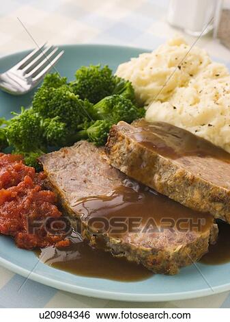 Mama's Meatloaf with Mashed Potato Broccoli Tomatoes and Gravy View Large Photo Image Stock Photograph - Mama's Meatloaf with Mashed Potato Broccoli Tomatoes and Gravy. Fotosearch