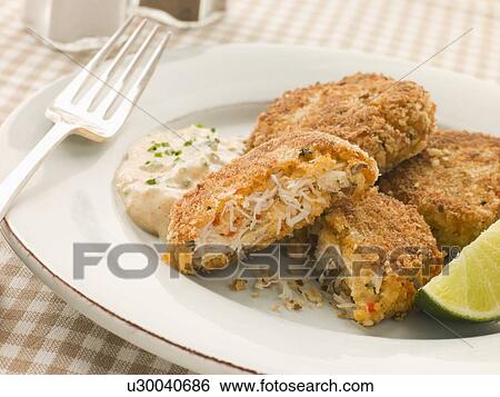 Stock Photograph - Maryland Crab Cakes with Curry Mayonnaise. Fotosearch