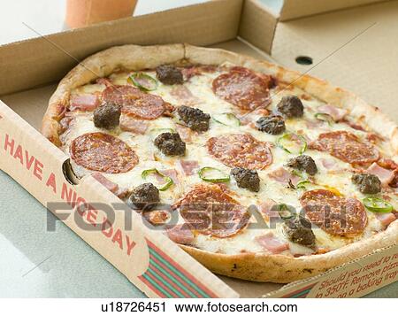 Stock Image - Meat Feast Pizza in a Take Away Box. Fotosearch