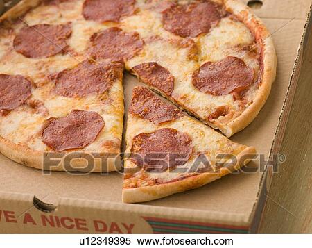 Stock Photography - Pepperoni Pizza in a Take Away Box with a Cut Slice. Fotosearch