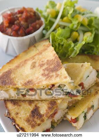 Quesadillas with Cajun Chicken Cheese Tomato Salsa and corn Salad View Large Photo Image Picture - Quesadillas with Cajun Chicken Cheese Tomato Salsa and corn Salad. Fotosearch