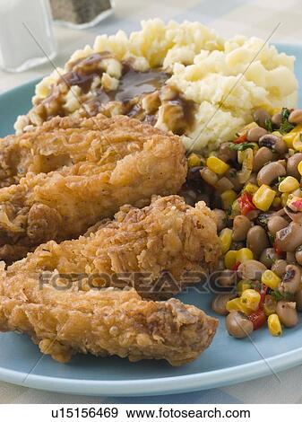 Southern Fried Chicken Wings with Mash Potato Beans and Gravy View Large Photo Image Stock Photo - Southern Fried Chicken Wings with Mash Potato Beans and Gravy. Fotosearch