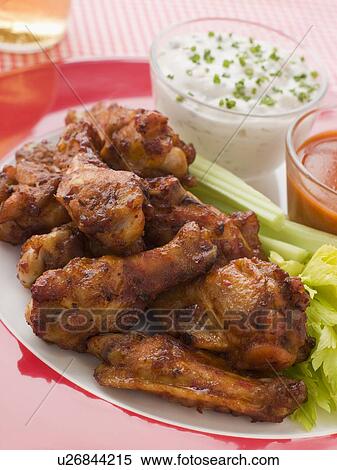 Spicy Buffalo Wings with Blue Cheese Dip Celery and Hot Chilli Sauce View Large Photo Image Stock Photography - Spicy Buffalo Wings with Blue Cheese Dip Celery and Hot Chilli Sauce. Fotosearch