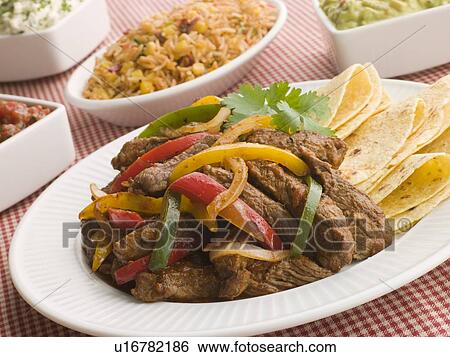Steak Fajitas with Jambalaya Guacamole Salsa and Sour Cream View Large Photo Image Stock Photograph - Steak Fajitas with Jambalaya Guacamole Salsa and Sour Cream. Fotosearch