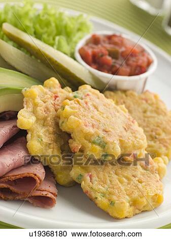 Sweet corn Fritters with Salsa Gherkins Avocado and Pastrami View Large Photo Image Stock Image - Sweet corn Fritters with Salsa Gherkins Avocado and Pastrami. Fotosearch