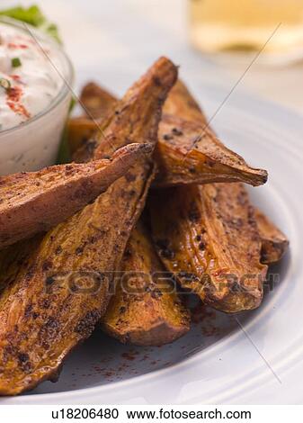 Stock Image - Sweet Potato Skins with a Blue Cheese Dip. Fotosearch