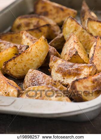 Tray of Spiced Potato Skins View Large Photo Image Stock Photo - Tray of Spiced Potato Skins. Fotosearch