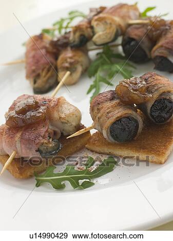 Angels and Devils on Horseback on Toasts View Large Photo Image Stock Photo - Angels and Devils on Horseback on Toasts. Fotosearch