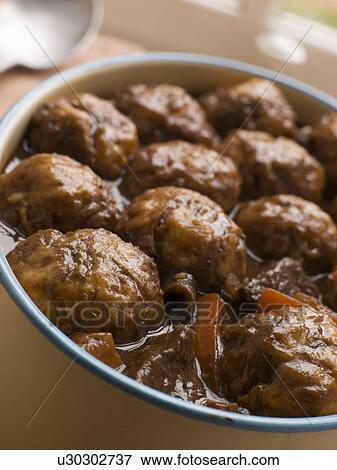Beef Stew and Herb Dumplings View Large Photo Image Stock Photo - Beef Stew and Herb Dumplings. Fotosearch