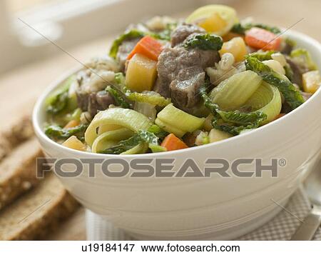 Stock Photo - Bowl of Irish Stew with Soda Bread. Fotosearch