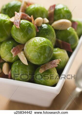 Stock Image - Brussel Sprouts with Fried Bacon and Almonds. Fotosearch