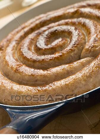 Cumberland Sausage Coil in a Frying Pan View Large Photo Image Picture - Cumberland Sausage Coil in a Frying Pan. Fotosearch