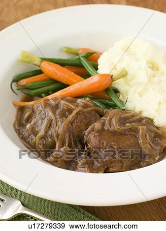 Faggots in Onion Gravy with Mashed Potato and Vegetables View Large Photo Image Stock Photo - Faggots in Onion Gravy with Mashed Potato and Vegetables. Fotosearch