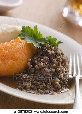 Stock Image - Plate of Haggis Neeps and Tatties. Fotosearch