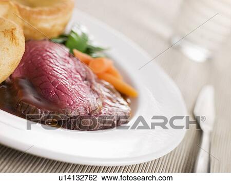 Roast Topside of British Beef with Yorkshire Pudding and Vegetables View Large Photo Image Stock Image - Roast Topside of British Beef with Yorkshire Pudding and Vegetables. Fotosearch