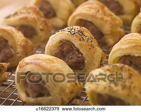 Stock Photo - Sausage Rolls on a Cooling Rack. Fotosearch