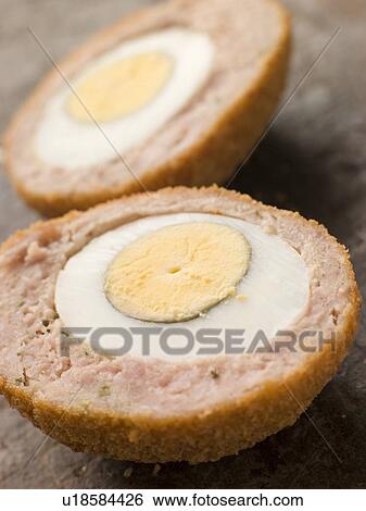 Scotch Egg cut in half View Large Photo Image Stock Photograph - Scotch Egg cut in half. Fotosearch