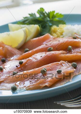 Scottish Smoked Salmon with Lemon Capers and Egg View Large Photo Image Stock Photo - Scottish Smoked Salmon with Lemon Capers and Egg. Fotosearch