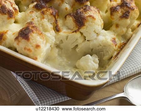 Stock Image - Serving of Cauliflower Cheese. Fotosearch