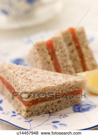 Stock Photo - Smoked Salmon Sandwich on Brown Bread with Afternoon Tea. Fotosearch