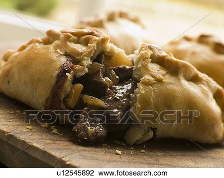 Traditional Cornish Pasty broken open View Large Photo Image Stock Image - Traditional Cornish Pasty broken open. Fotosearch