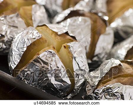 Tray of Jacket Potatoes Wrapped in Foil View Large Photo Image Stock Photography - Tray of Jacket Potatoes Wrapped in Foil. Fotosearch