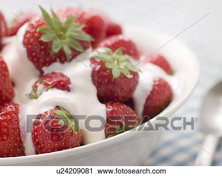 Stock Image - Bowl of Strawberries and Cream. Fotosearch