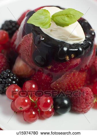 Stock Image - Champagne Berry Jelly with Clotted Cream. Fotosearch